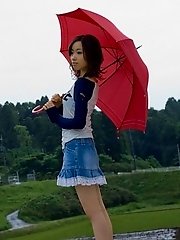 Cute Asian teen model in a mini skirt