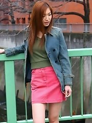 Asian beauty in a mini skirt shows her ass