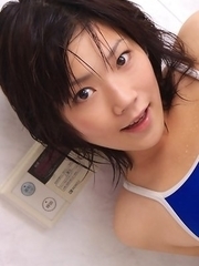 Airi Sakuragi puts soap and shower on body over bath suit